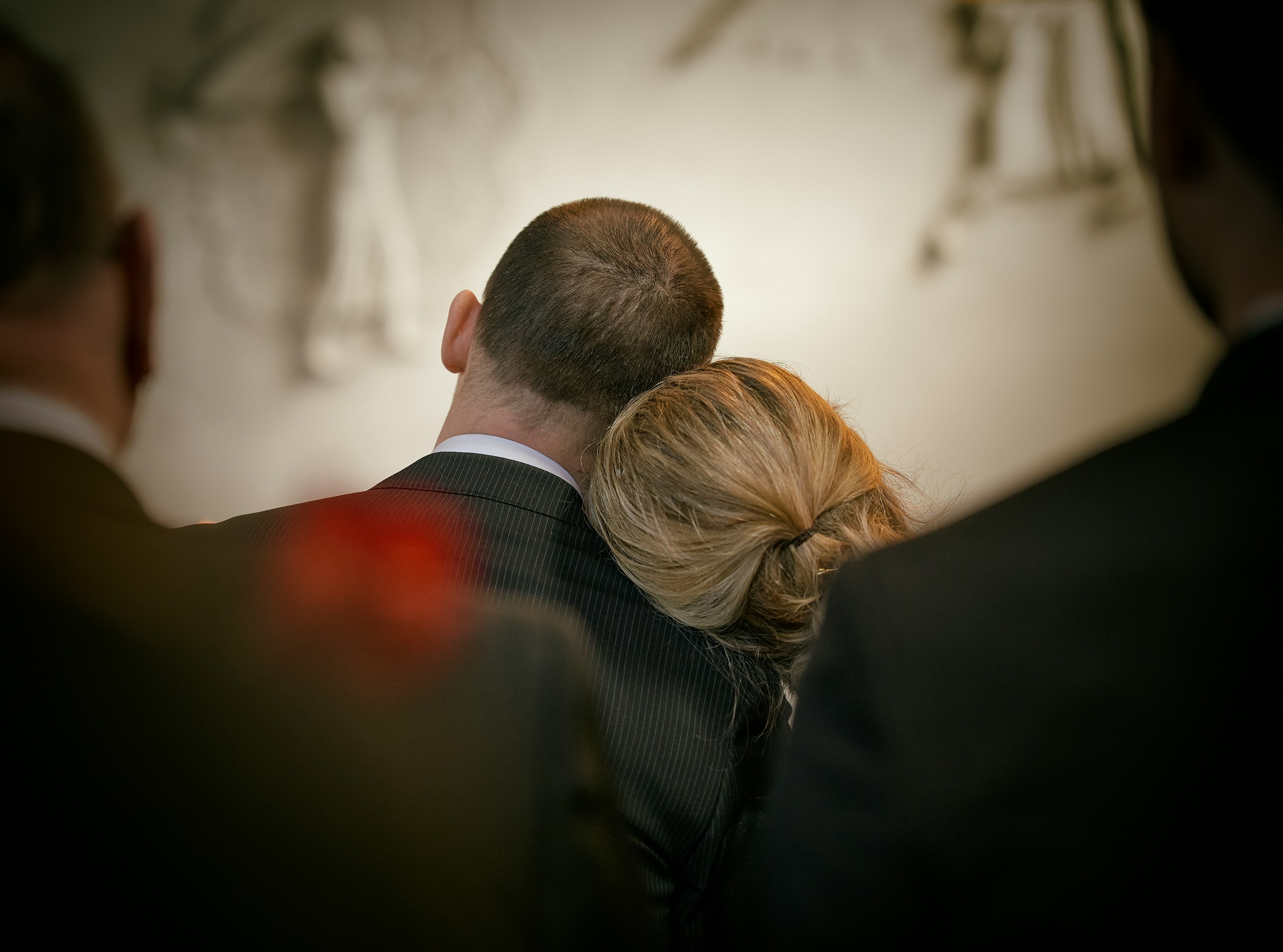 a man and a woman looking at the camera
