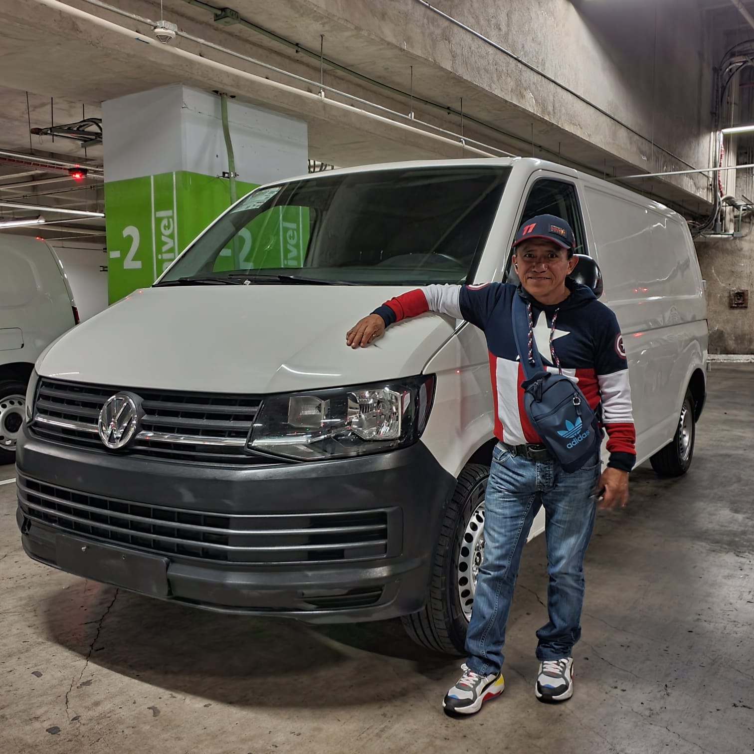 a woman holding a baby up in the air