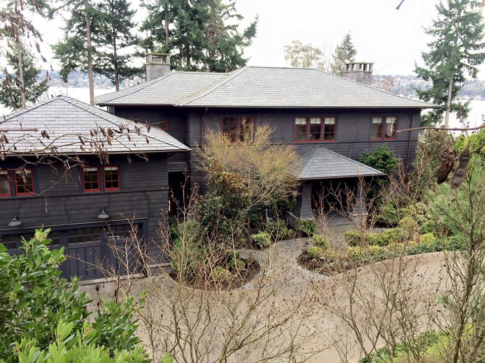 Mercer Island home. Here is a 6,000 Sq ft custom home built facing the water. We custom framed a flair at base of house continuing around complete perimeter including entree ways. We then installed pre primed trims, belly bands and shingles and aligned the bottom of shingle coursing to meet all the tops of windows.