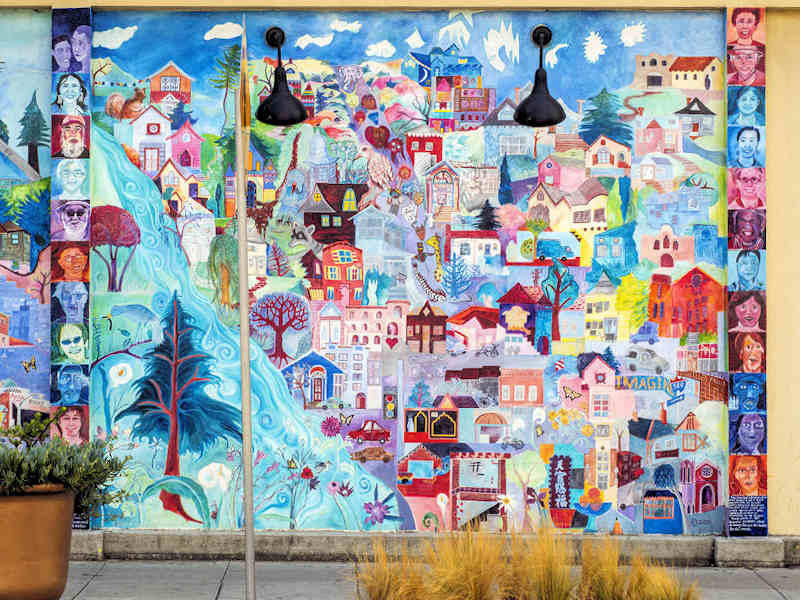 The work of community artist and educator Debra Koppman is seen throughout the neighborhood in mosaics and murals brought to life in collaboration with students and volunteers. 