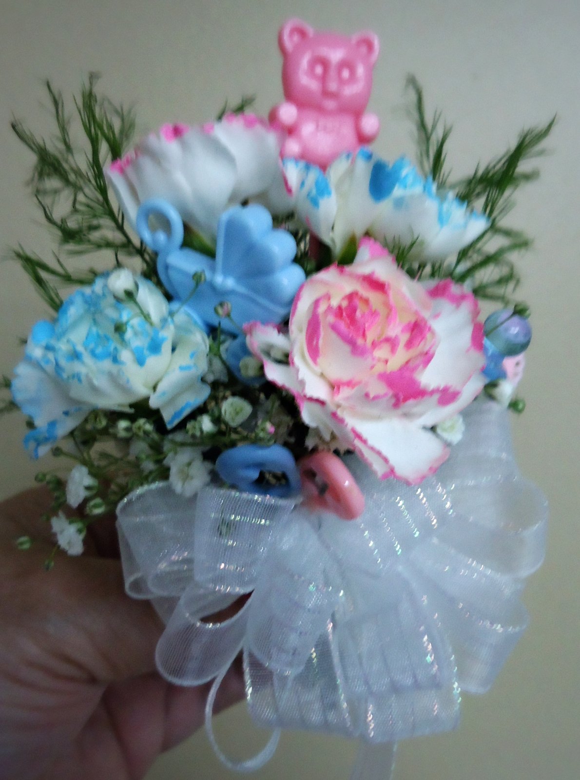 (26)  "Fresh" Baby Corsage  
   (Available Boy or Girl)
   (Also Fresh or Silk)
    $25.00 & Up