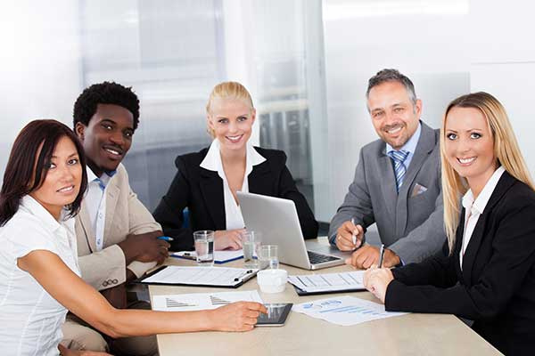 Group Of Businesspeople Discussing Together