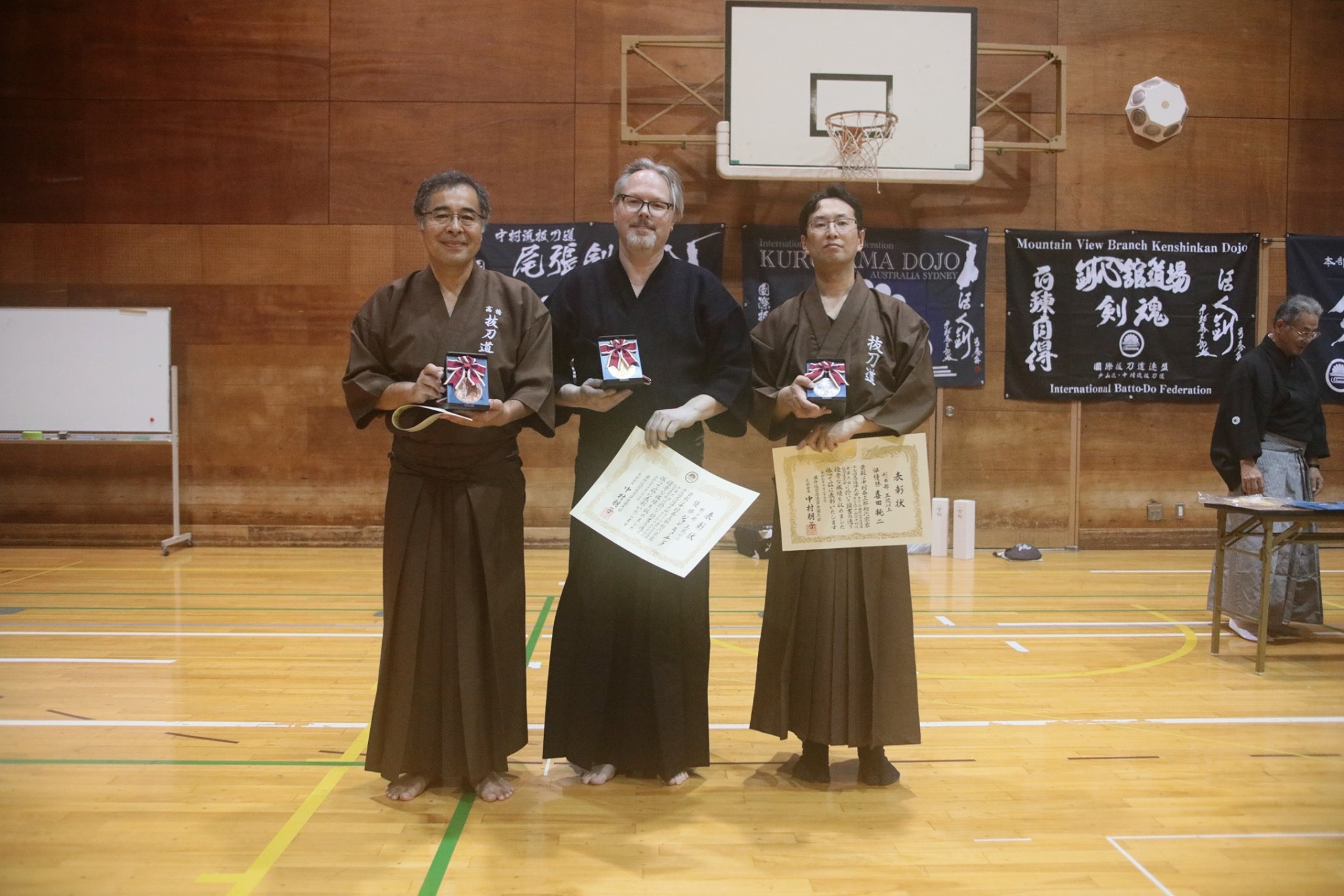 Tex with 1st place in Godan and above kata. You can see our new Dojo flag in the background - Nice!