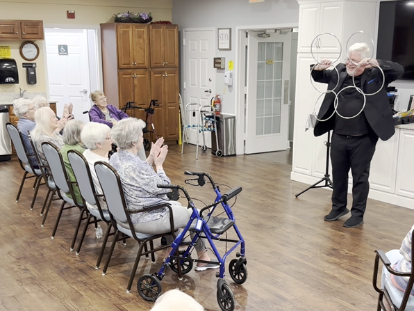 Chuck performing the Linking Rings for a senior crowd. Chuck performing the Linking Rings for a senior crowd.