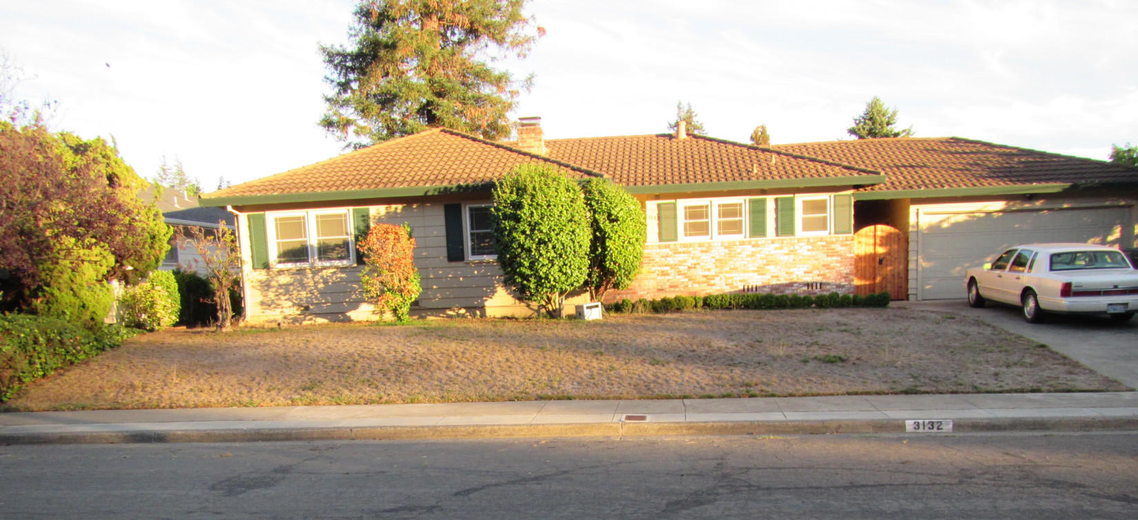 BEFORE - Lawn Removal. Replaced with a drought-tolerant landscape