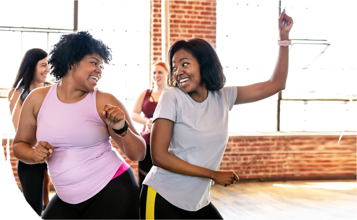 Women dancing and smiling Women dancing and smiling