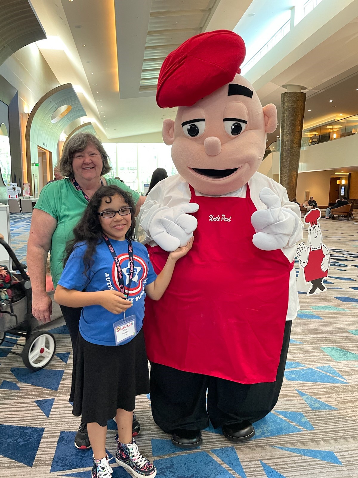 Lori Lamb, CWOCN, RN and an attendee hang out with Uncle Paul.
The Family Cafe 25th Anniversary in Orlando, FL.  June 2023.
