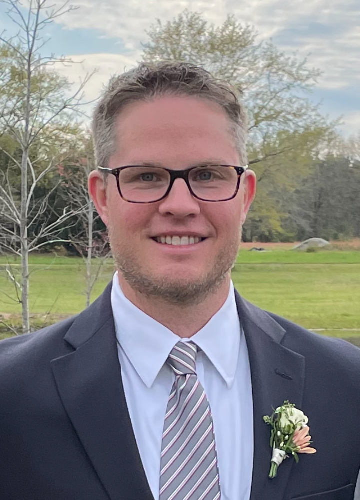 Smiling person with glasses