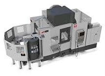 Modern CNC machine control panel with digital displays and buttons in an industrial setting.