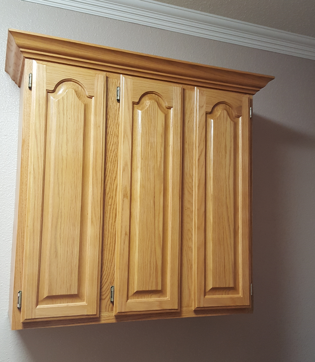 Features Crown Arched Paneled Doors
 made of Golden Oak Stained Hickory Wood.