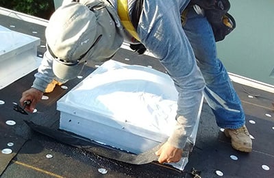 Man Repairing Roof
