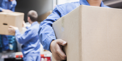 Movers unloading a moving van