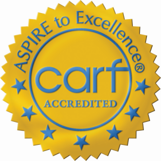 CARF accredited gold seal badge with Aspire to Excellence text