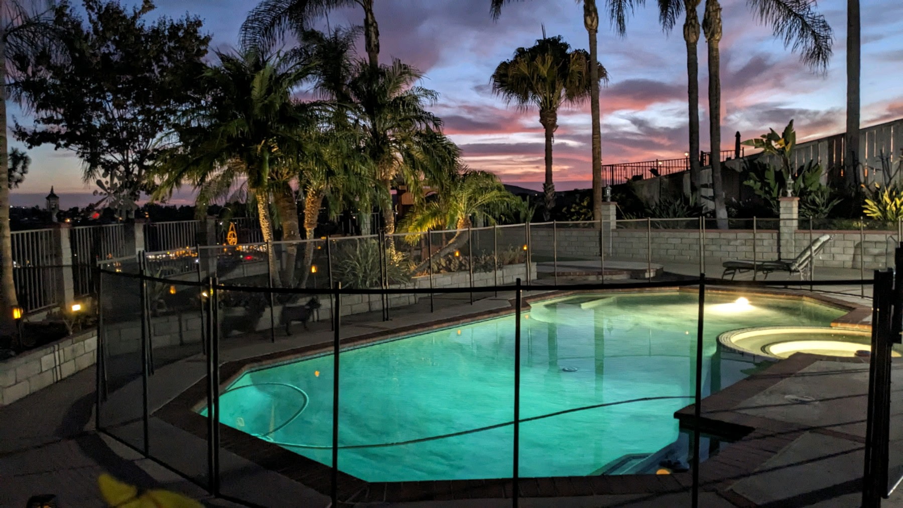 Three men in casual clothing having a conversation on a sunny patio with lush greenery in the background. Three men in casual clothing having a conversation on a sunny patio with lush greenery in the background.