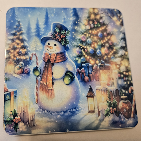 Square metal coaster with a snowman design