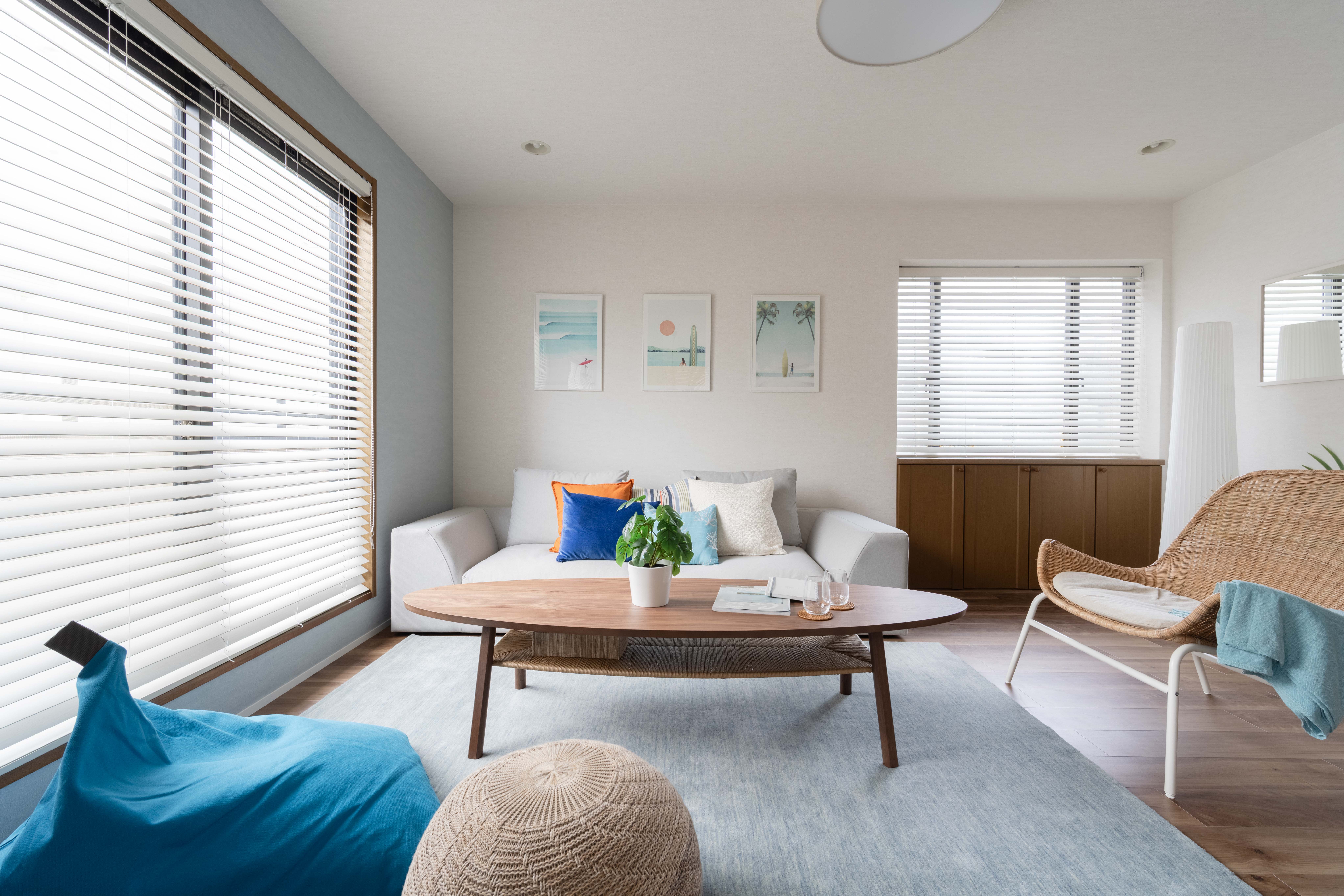 Living Room with sofa, chair, bean bag, and pouf