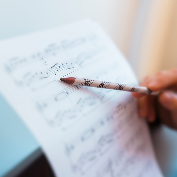 Teacher explaining correct music lecture of piano