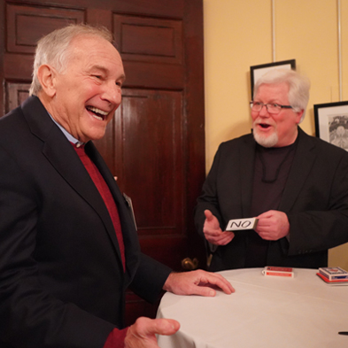 Chuck performing one-on-one magic with a party guest.