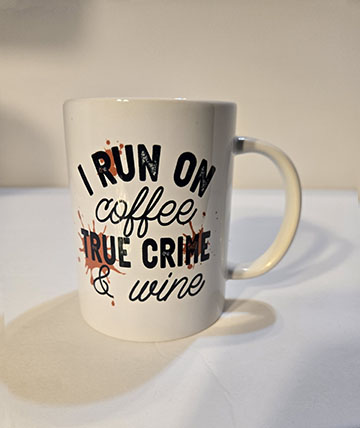 15oz ceramic mug featuring a I run on true crime desing