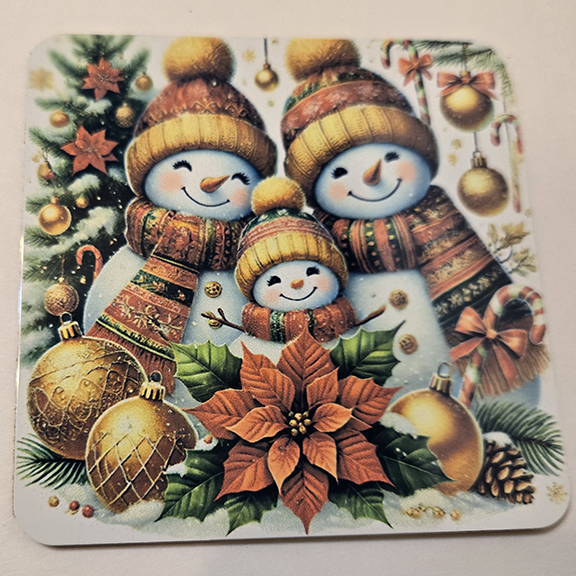 Square metal coaster with a snowmen design