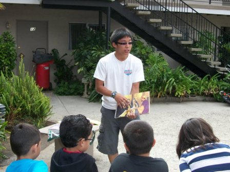 Luke teaching Bible Club young children