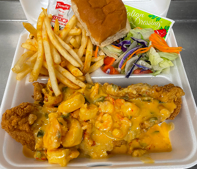 A plate full of french fries, and catfish