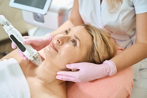 woman having microneedling treatment