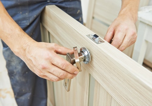 Carpenter At Door Lock Installation