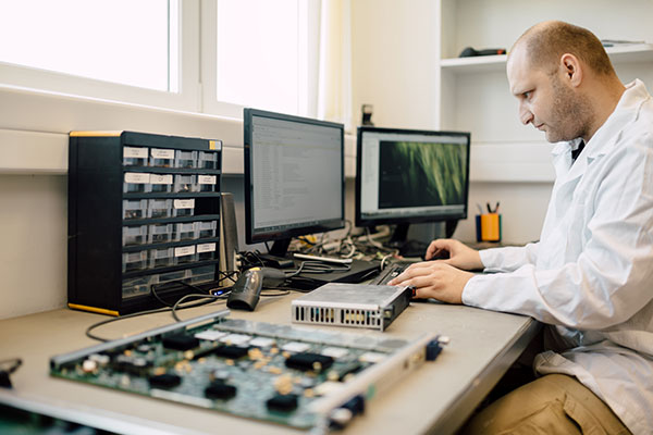 Technician Repairing Cmts Cards