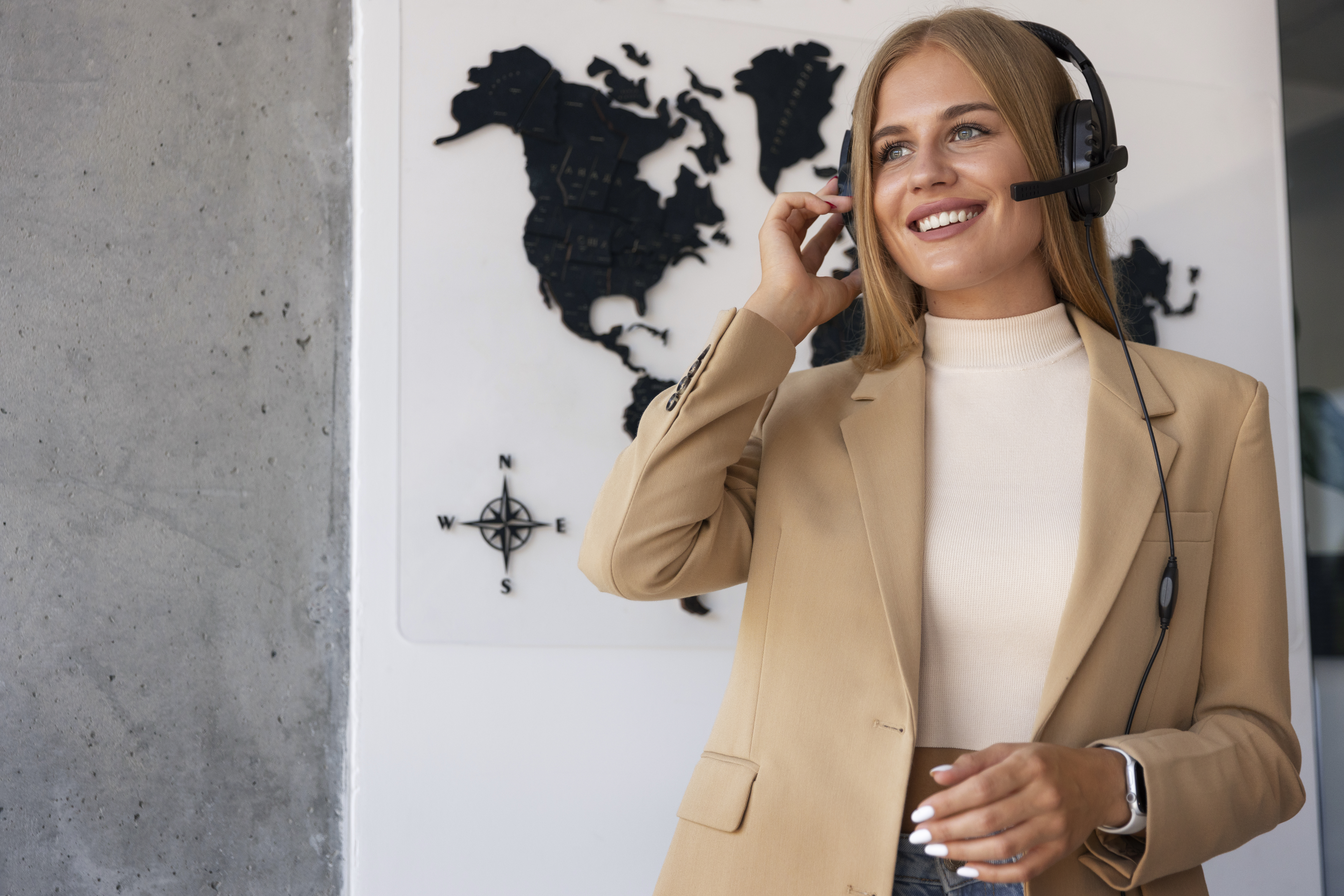 Person holding an iPhone in front of a MacBook