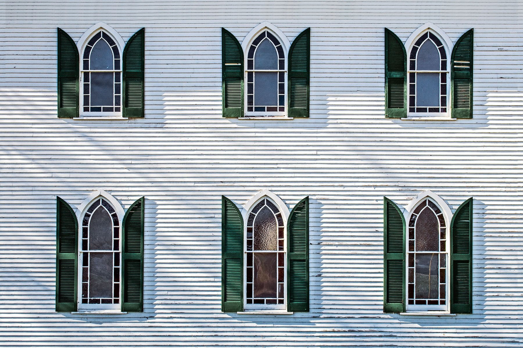 FLYING WINDOWS - The windows in this photo occupy one side of an old church building close to Big Bone Lick state park in northern Kentucky. Maybe they’re angels’ wings.