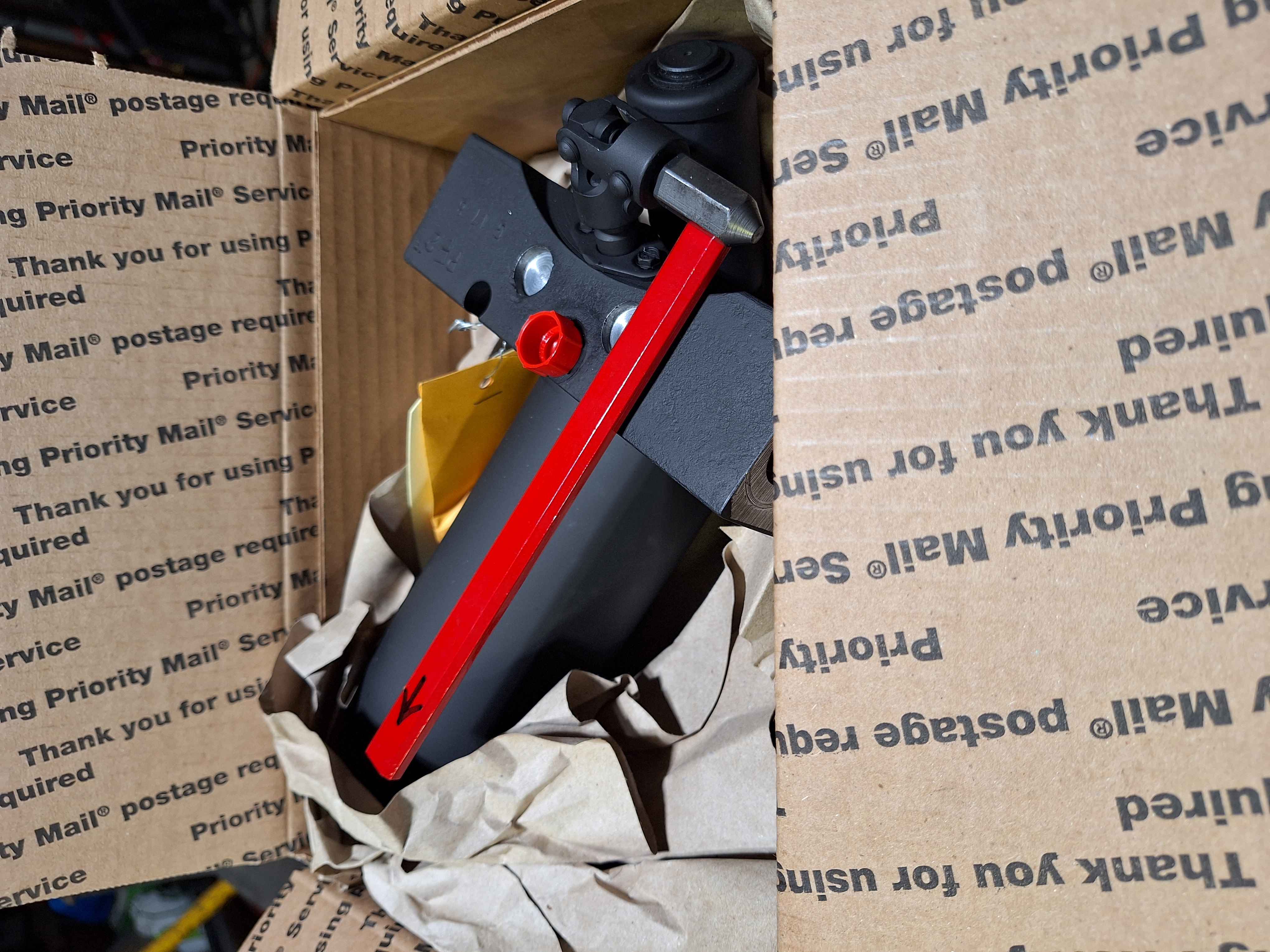 Raise front of unit up with packing to drop rear.