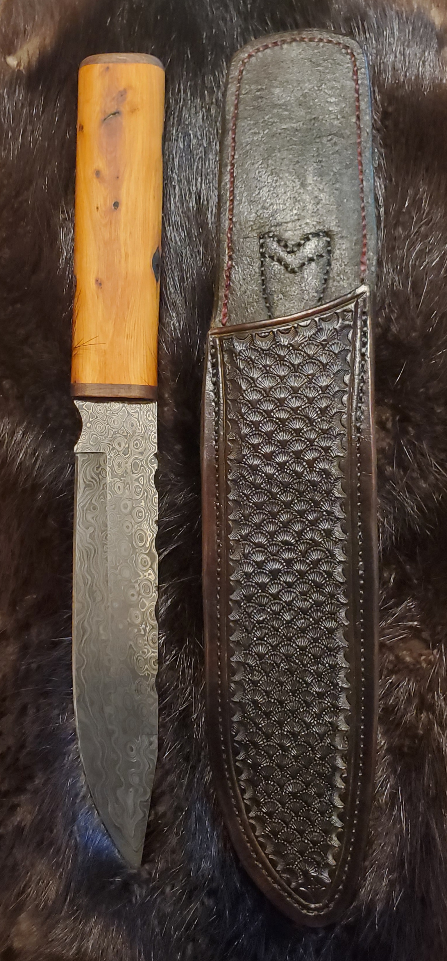 Damascus Bowie knife with hand tooled and stitched sheath,  $245.00     SOLD