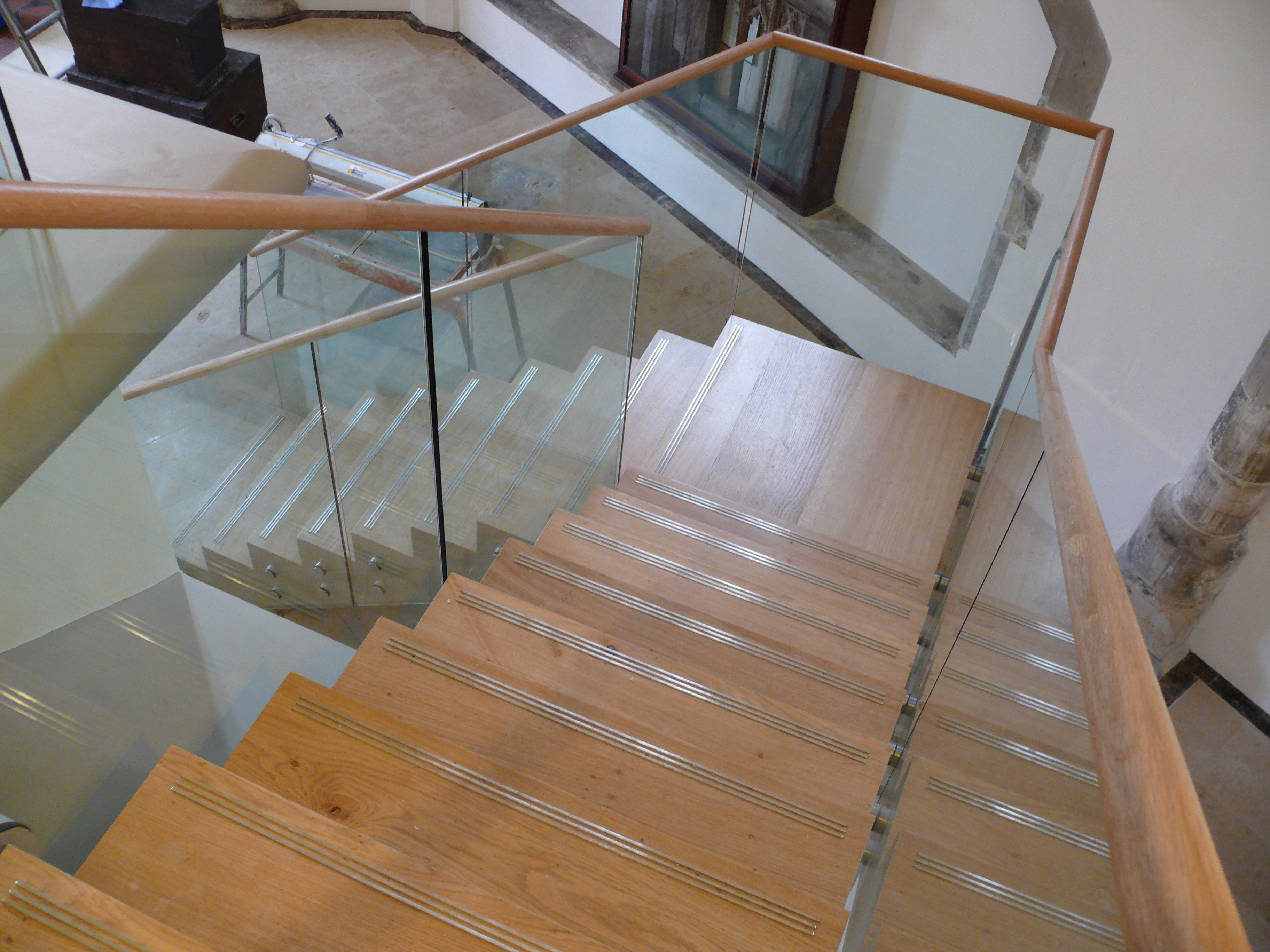 a room with a table chairs and a lamp