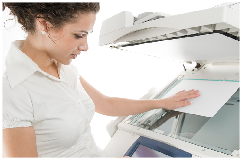 Woman operating the copier||||