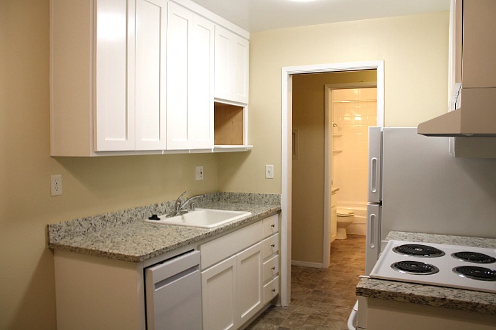 Kitchen will have new, granite countertops and new cabinet like the apartment shown here.
