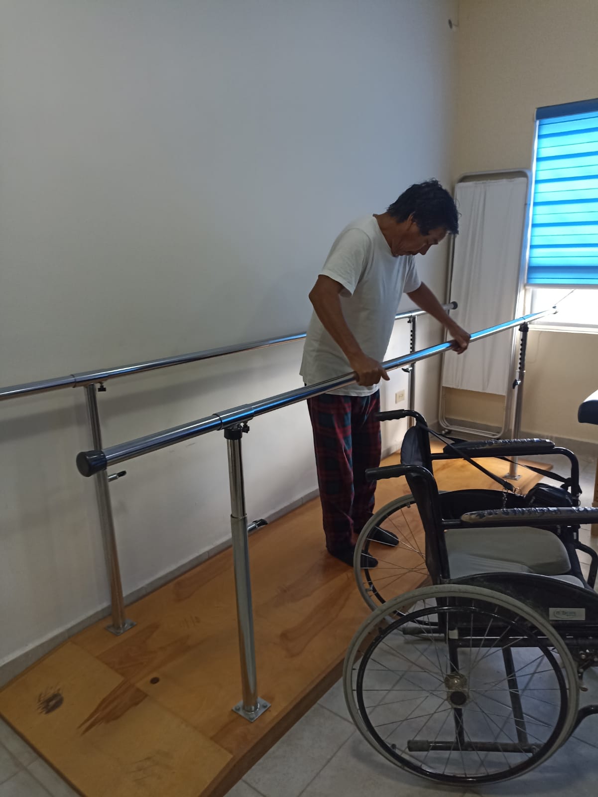 A smiling woman wearing a headset at a computer.