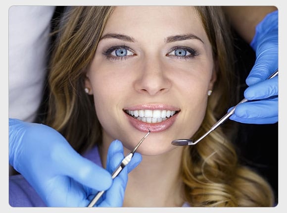 Woman in a Dental Examination at Dentist