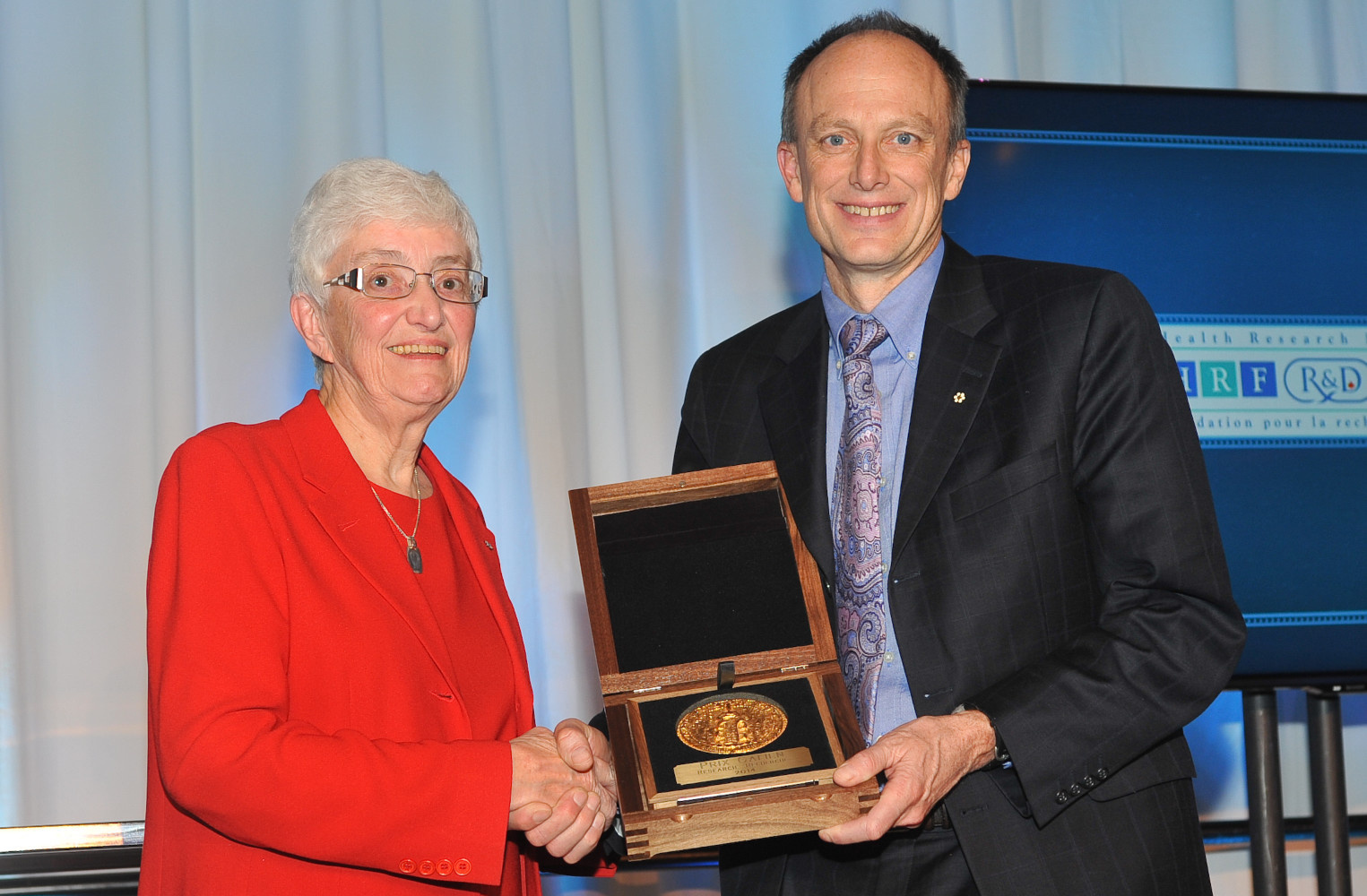 2014 - Dr. Brett Finlay accepting the Prix Galien Canada Research Award from Dr. Jean Gray