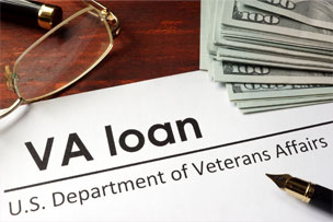 Paper With Words VA Loan On A Wooden Background