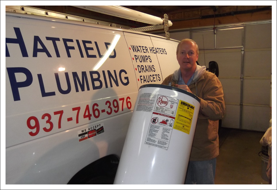Plumber in front of van||||