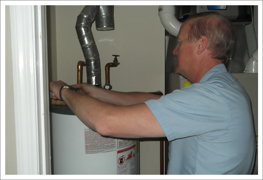 Plumber installing hot water heater||||