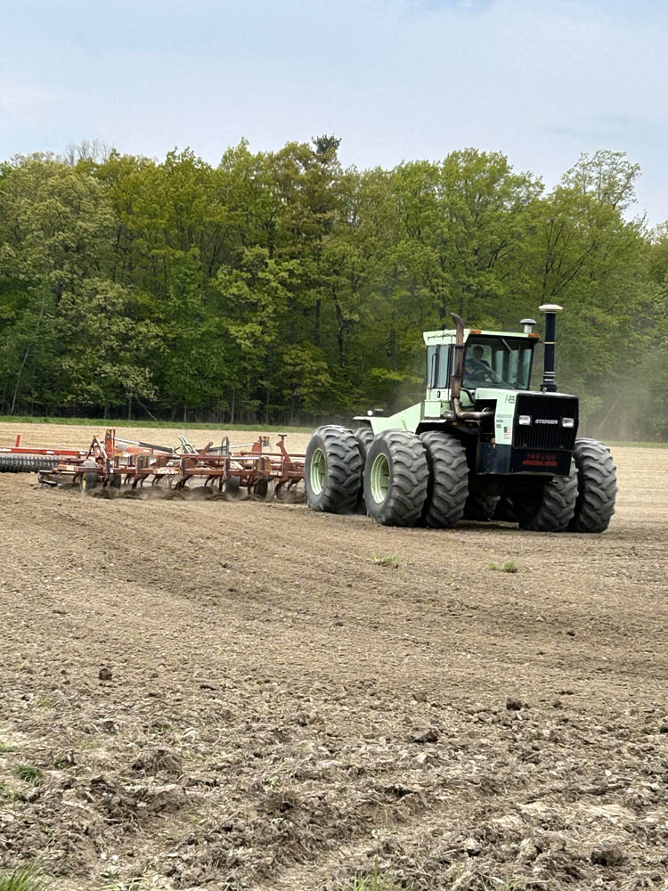 OFM member getting field ready to plant