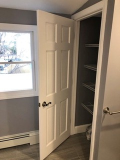 Framed and finished a much needed linen closet for convenient storage of bathroom essentials