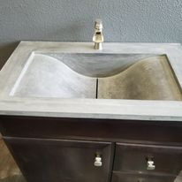 A sink with a stone surface