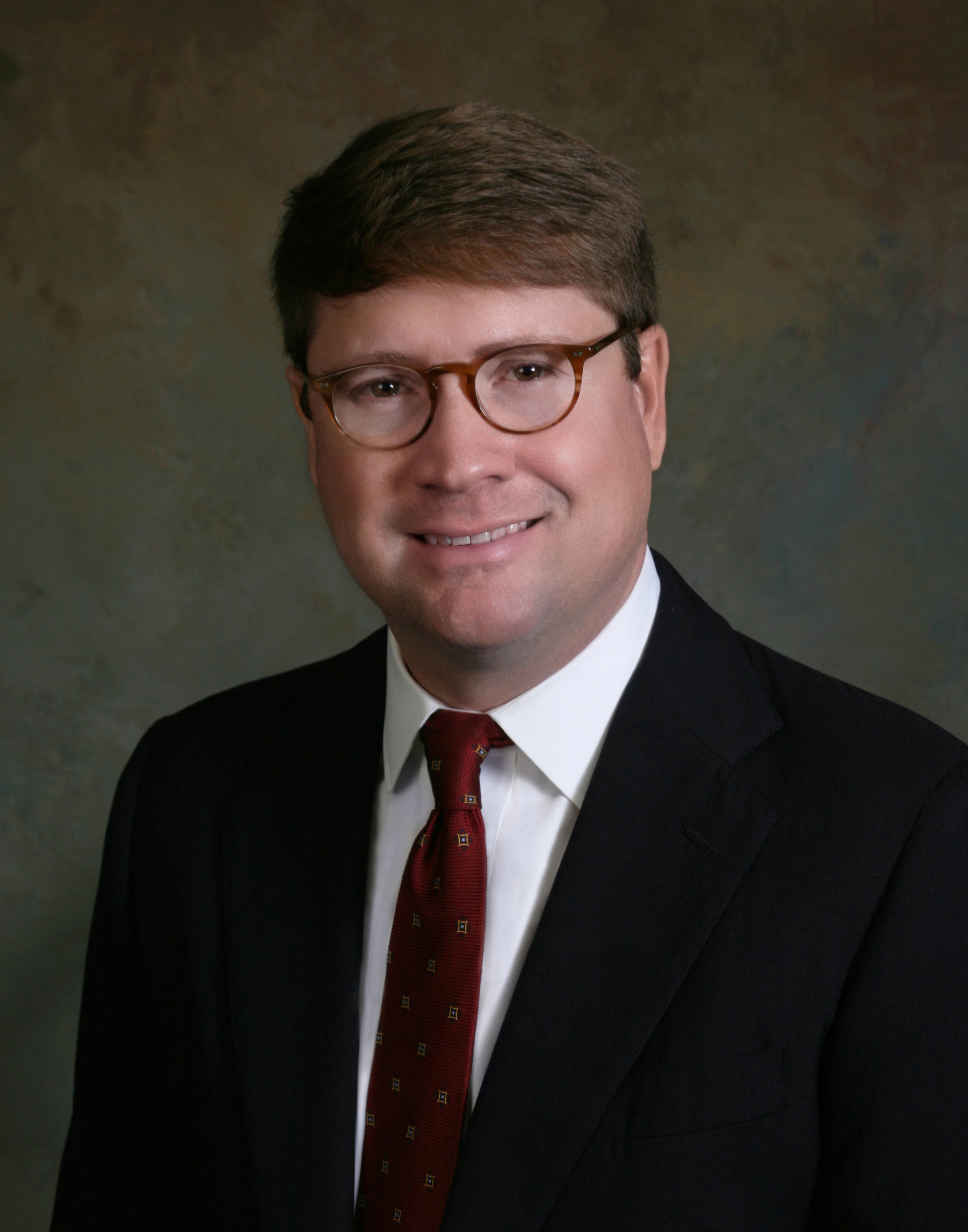 Portrait of a man in a suit and tie