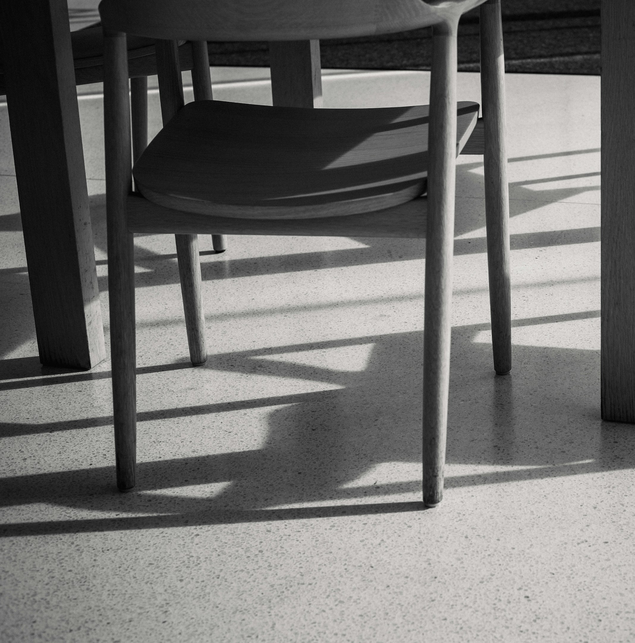 Chairs and tables casting shadows on floor