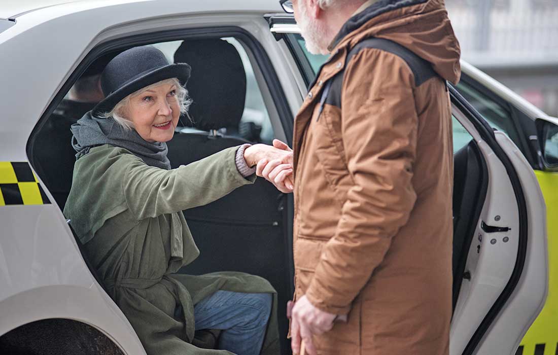 Old Man Is Helping Elegant Senior Woman