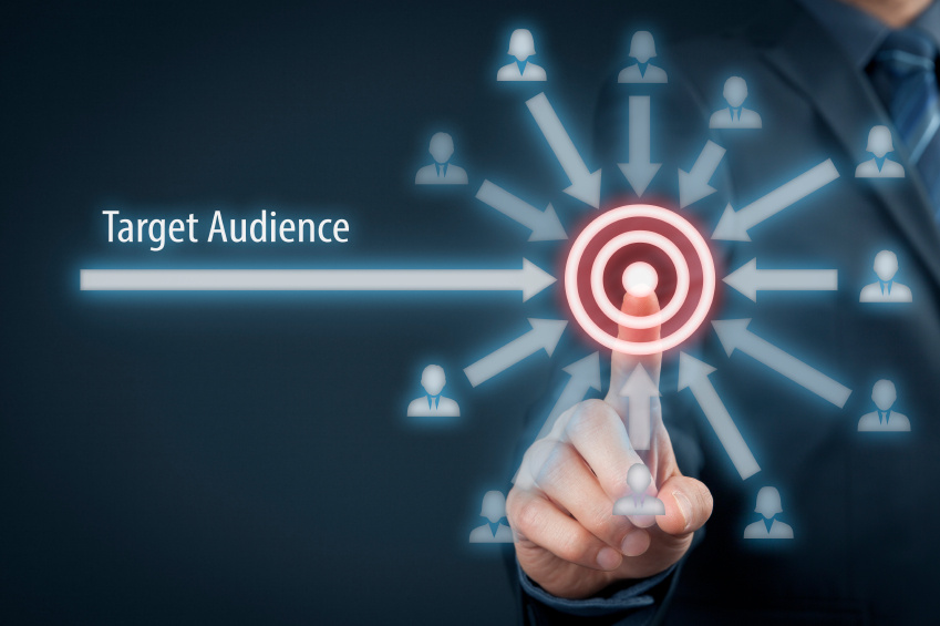 Businessman selecting target audience with digital marketing icons and arrows pointing to customer bullseye
