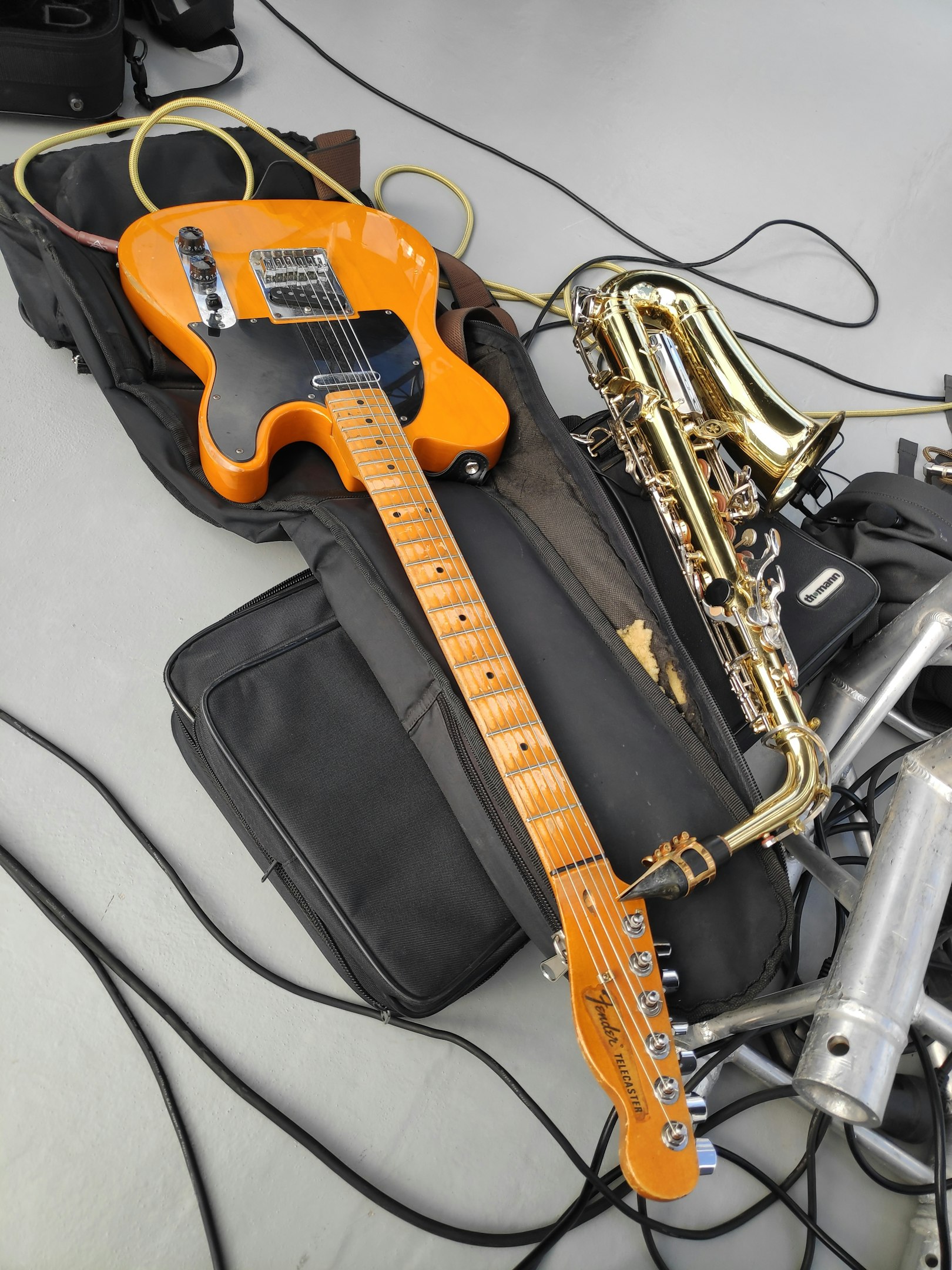A guitar and other musical instruments are on a table